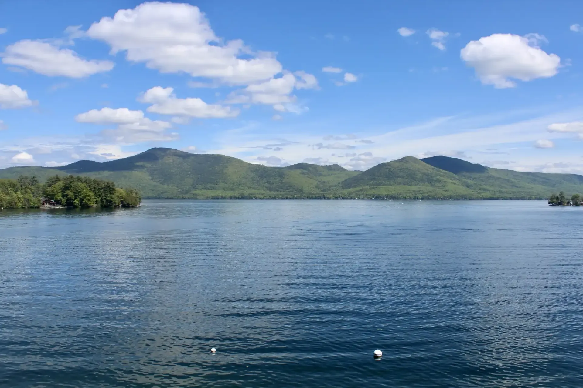 A large body of water with mountains in the background