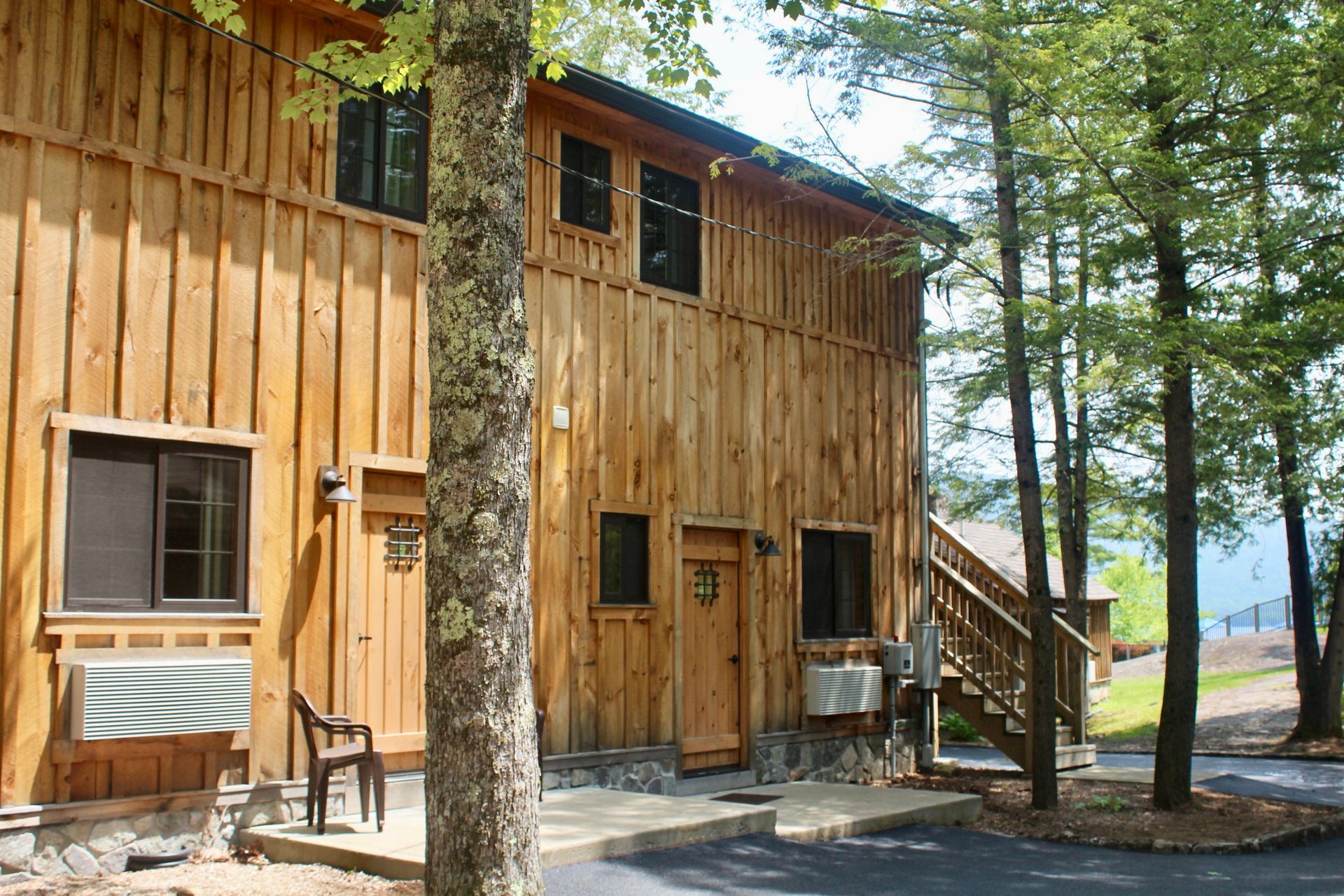 A large wooden building with stairs leading up to it