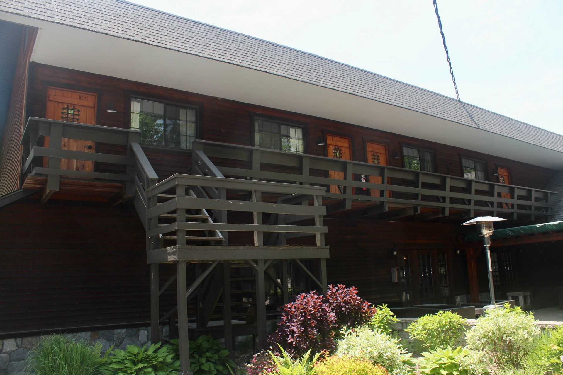 A building with a balcony and stairs leading up to it