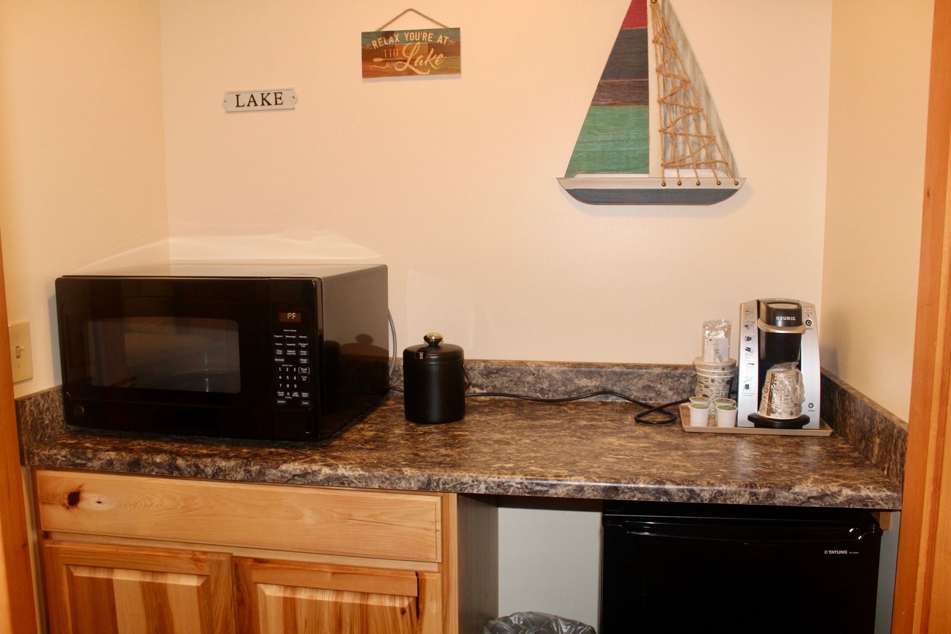 A kitchen counter with a microwave and a coffee maker