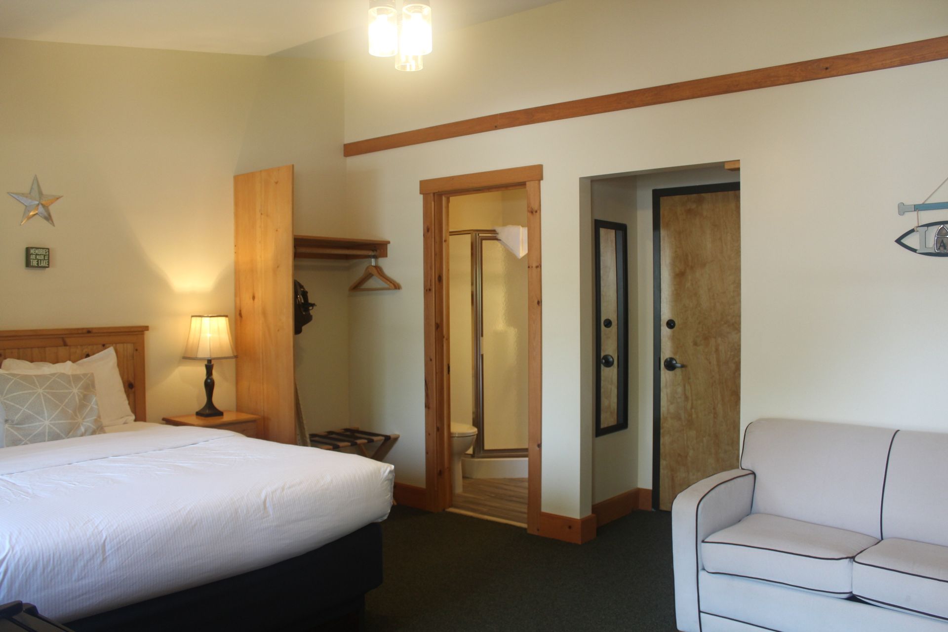 A hotel room with a bed and a couch