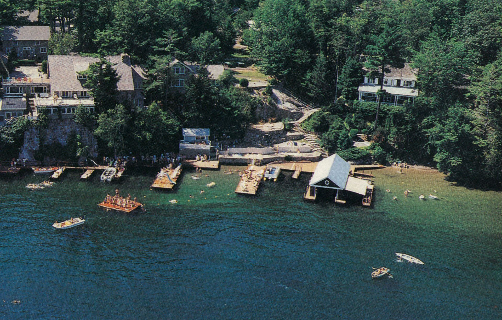 An aerial view of a lake with boats in it