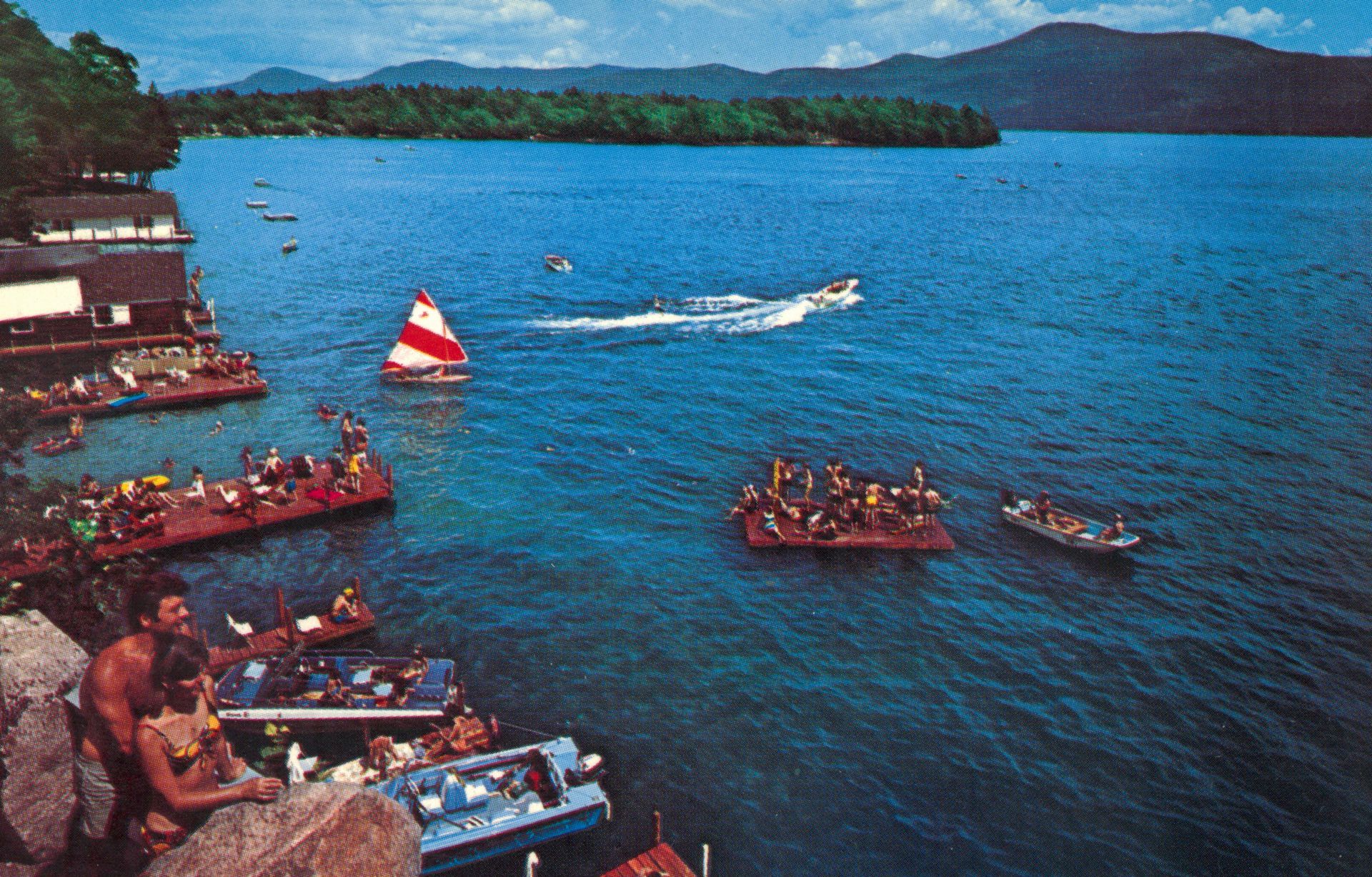 A group of people are sitting on rafts in the water.