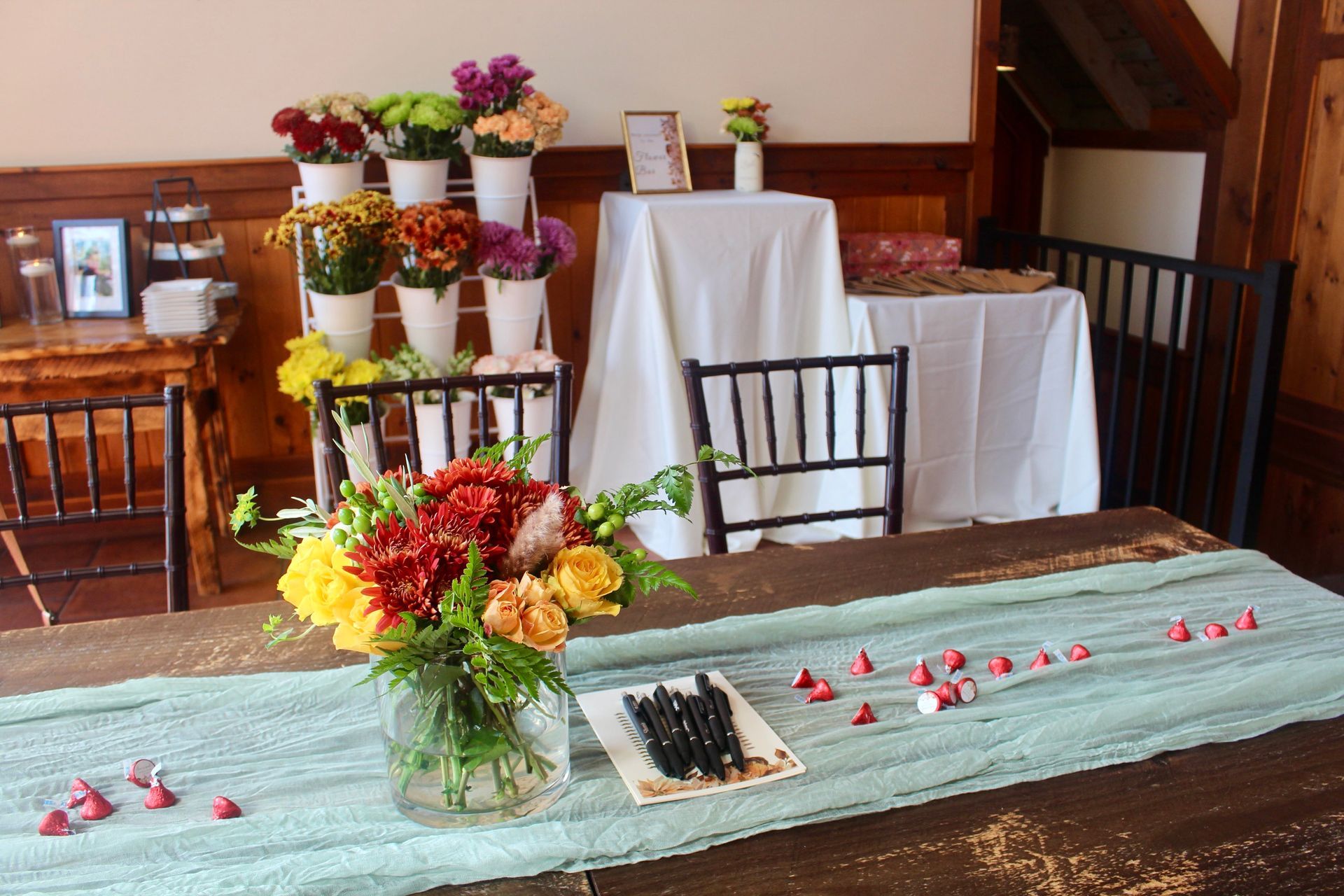 A table with a vase of flowers on it