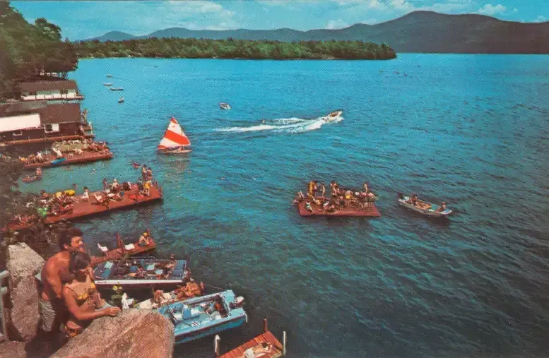 A group of people are sitting on rafts in the water