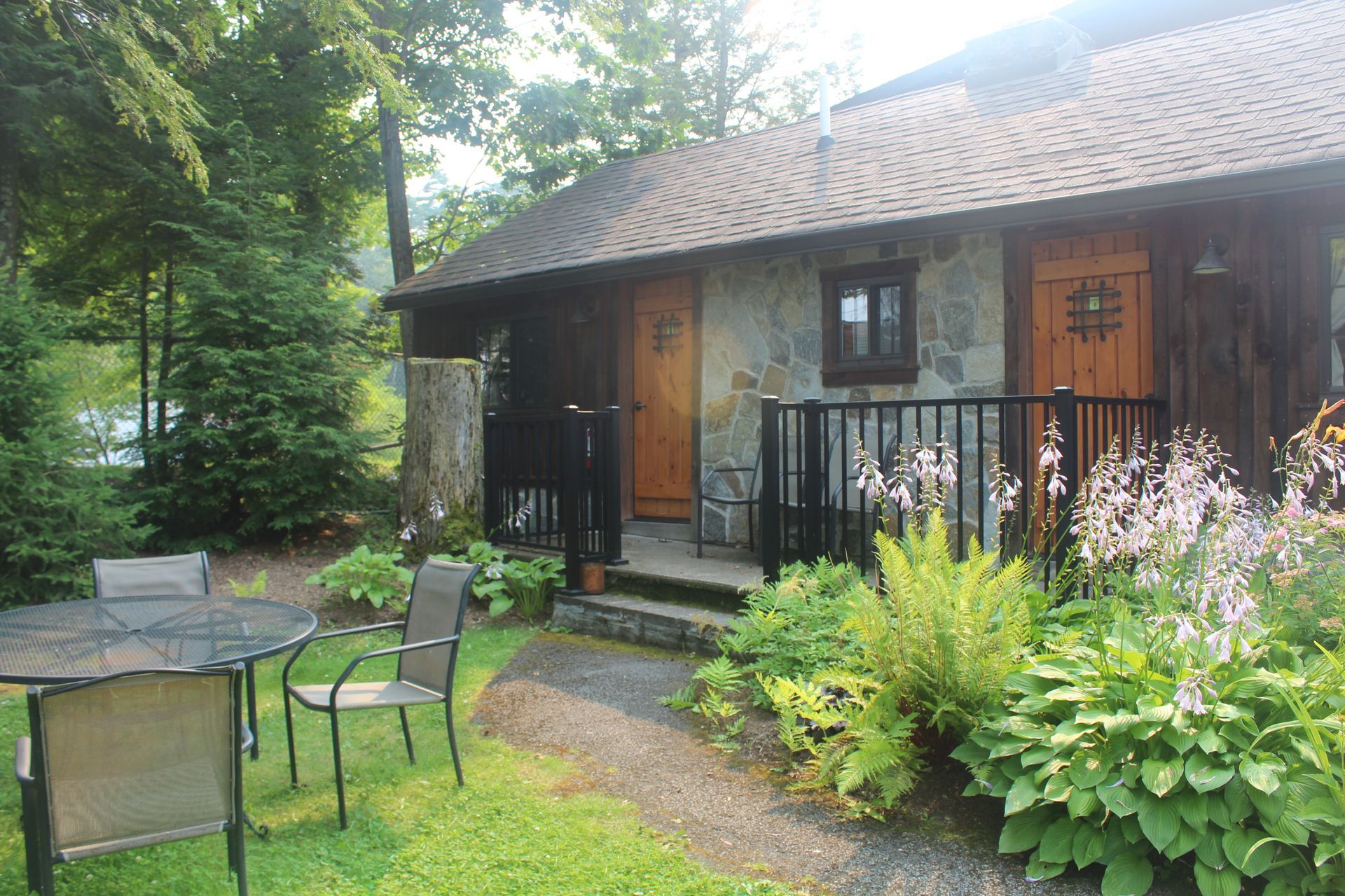 A small house with a table and chairs in front of it
