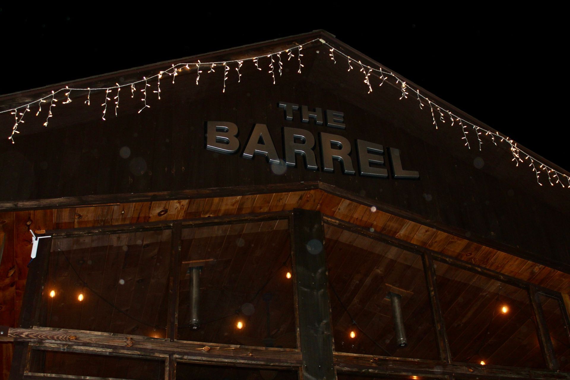 A building with a sign that says the barrel on it