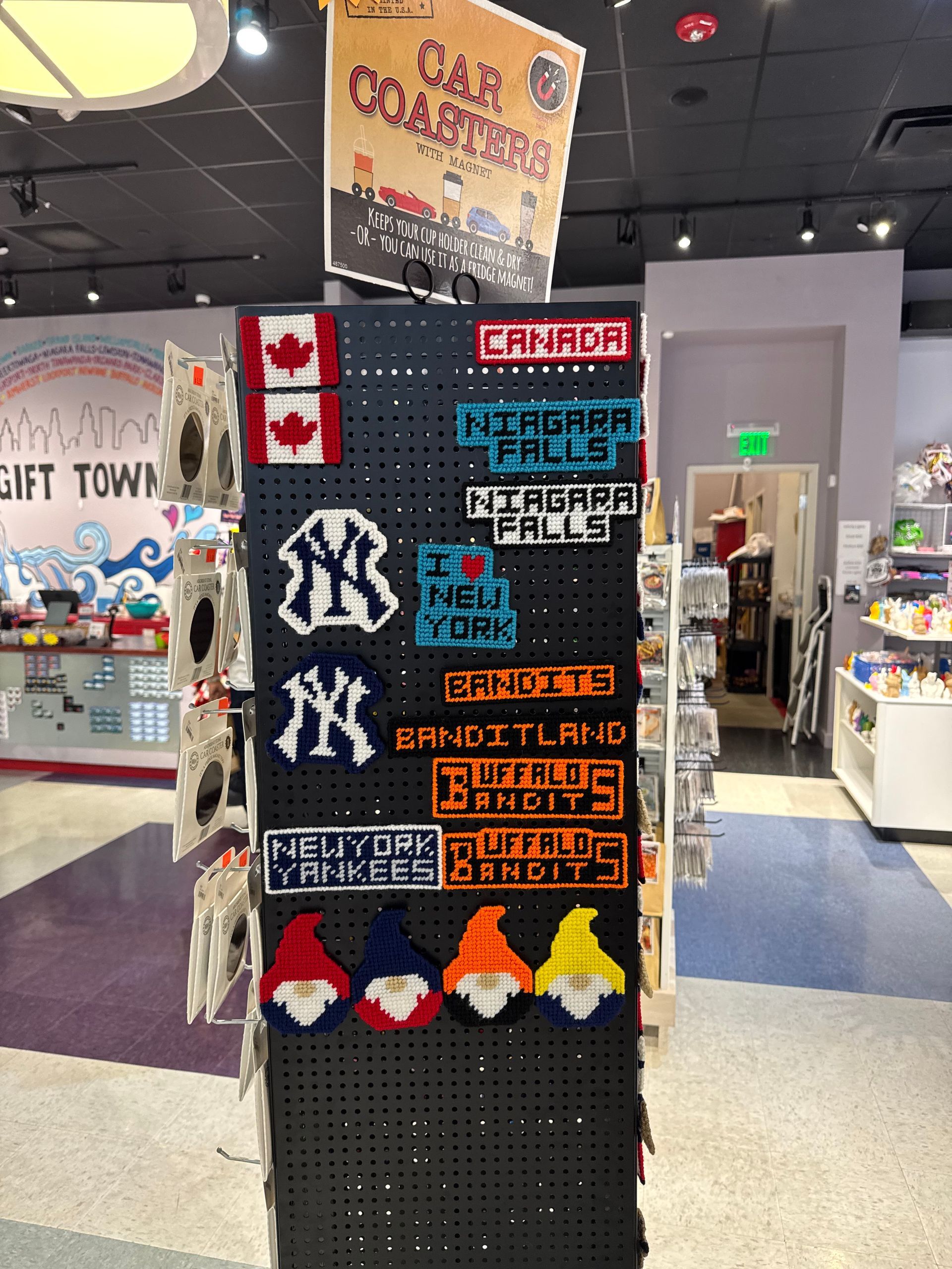 Souvenir display with Canada, New York, and gnome-themed items.