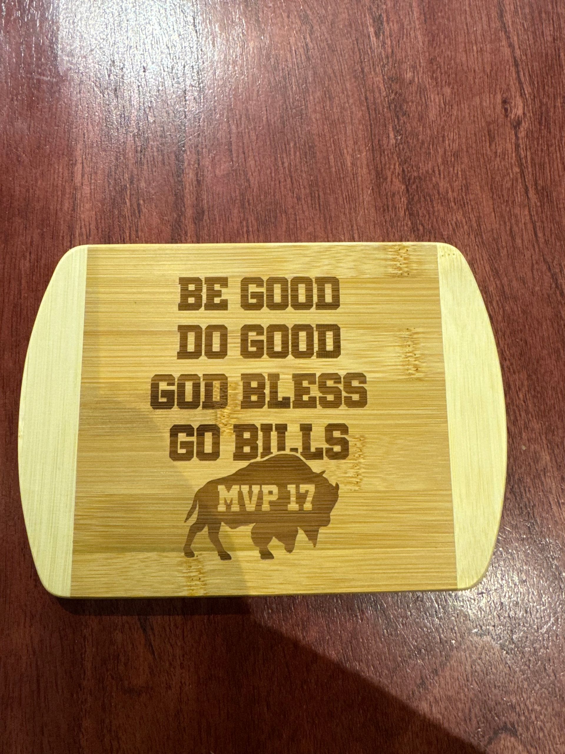 Wooden cutting board with etched text: 