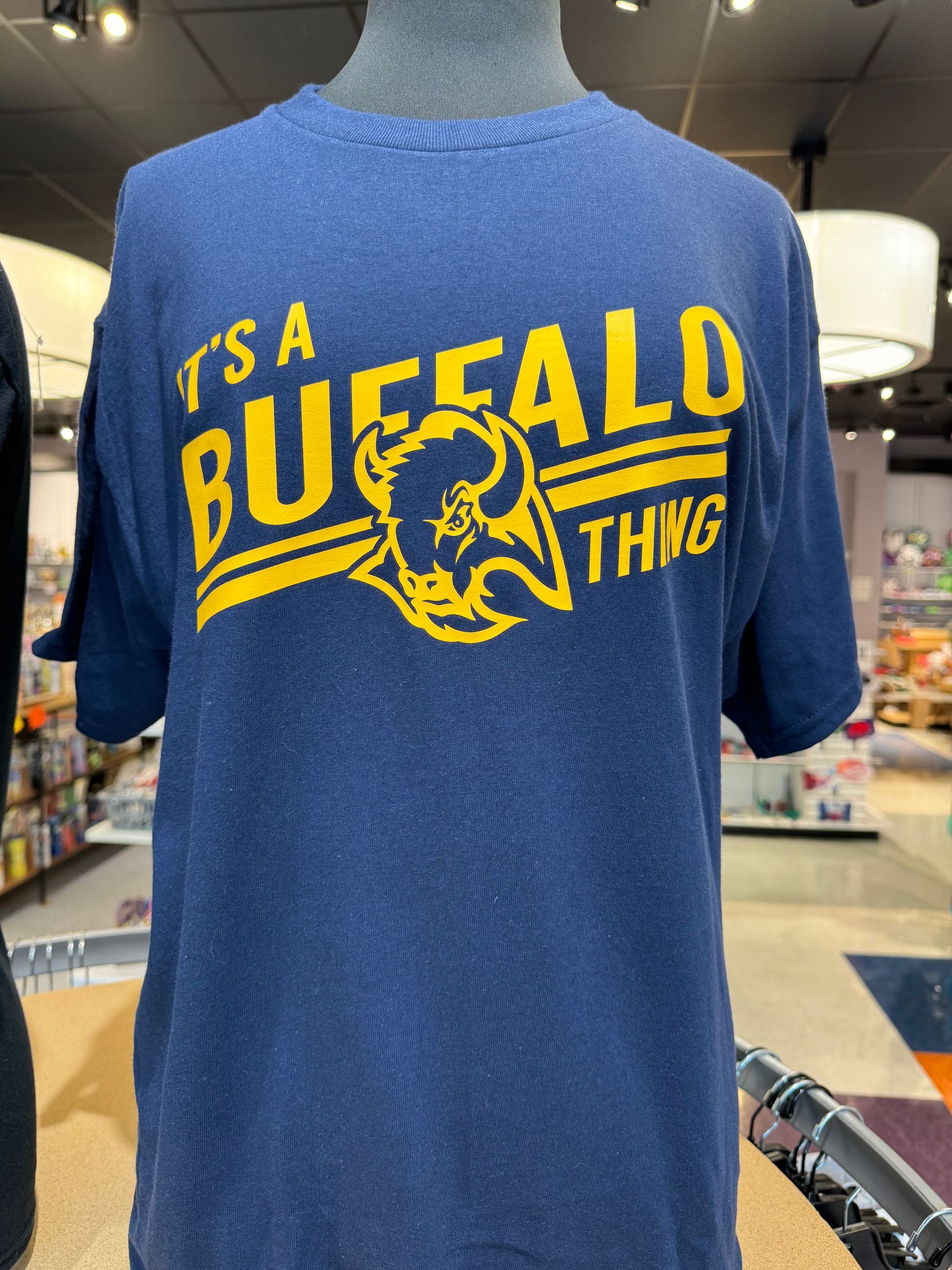 Navy blue t-shirt with gold text: 