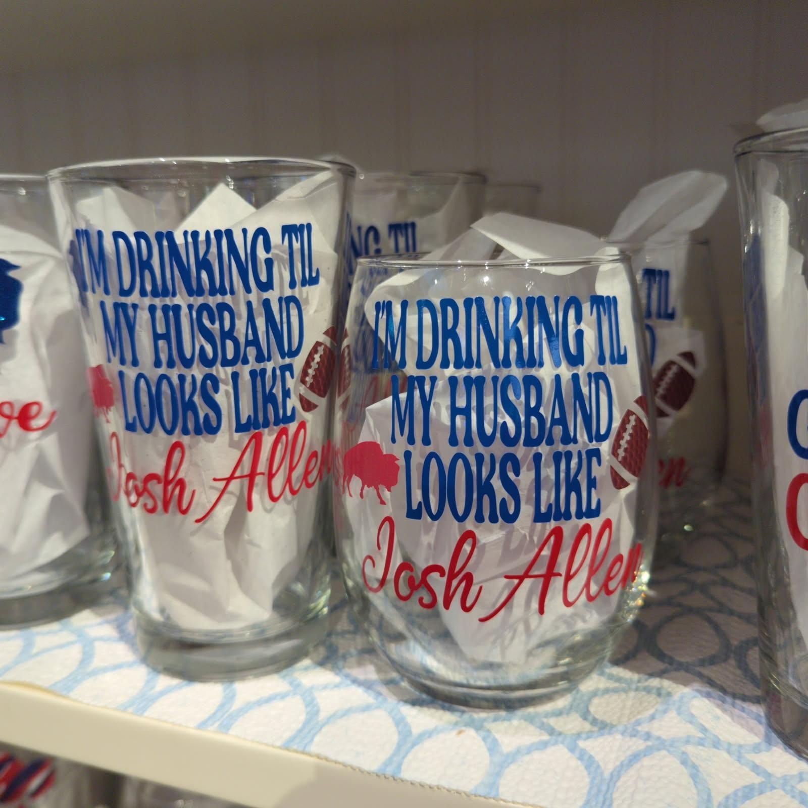 Two drinking glasses with the text 