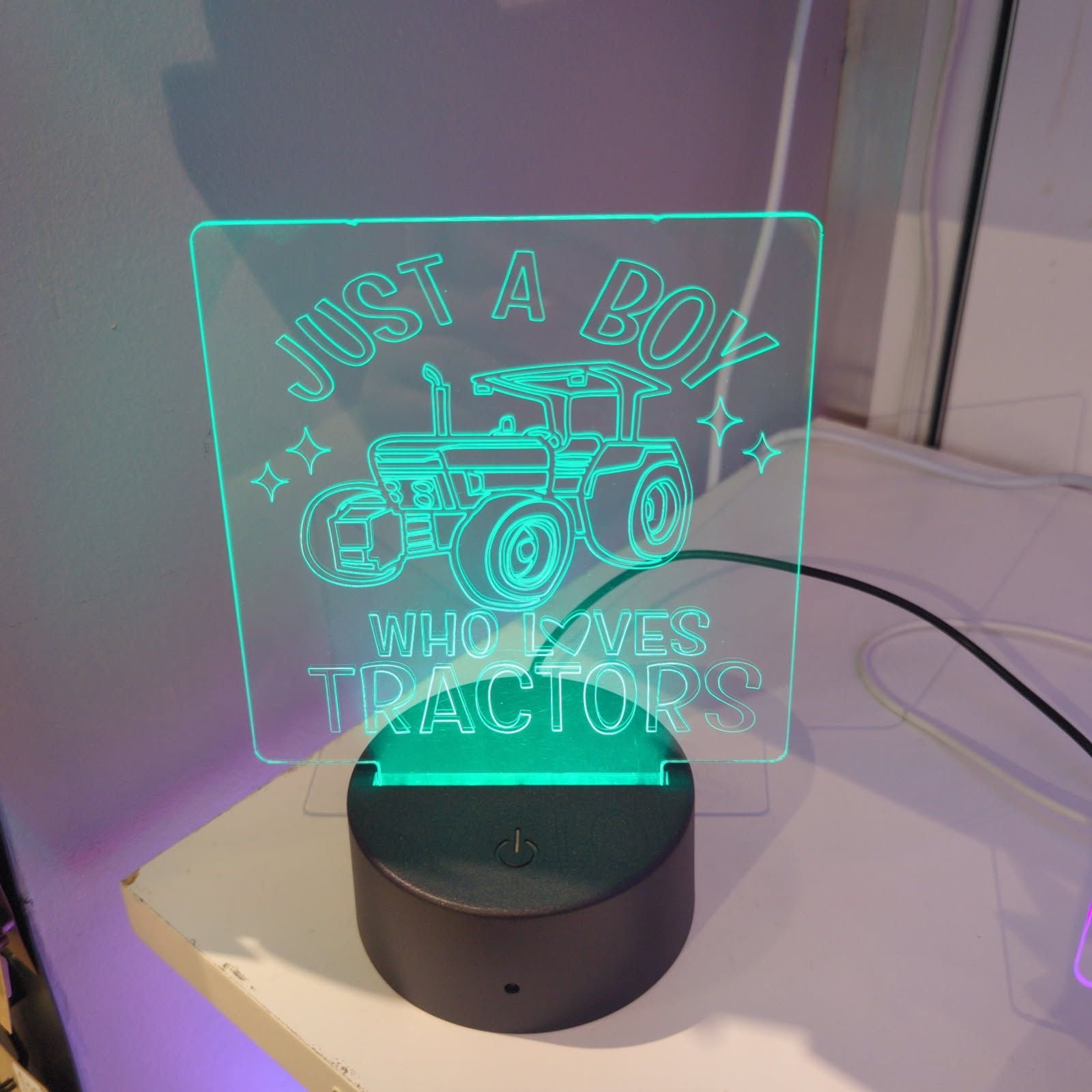 Green tractor-themed night light with text 