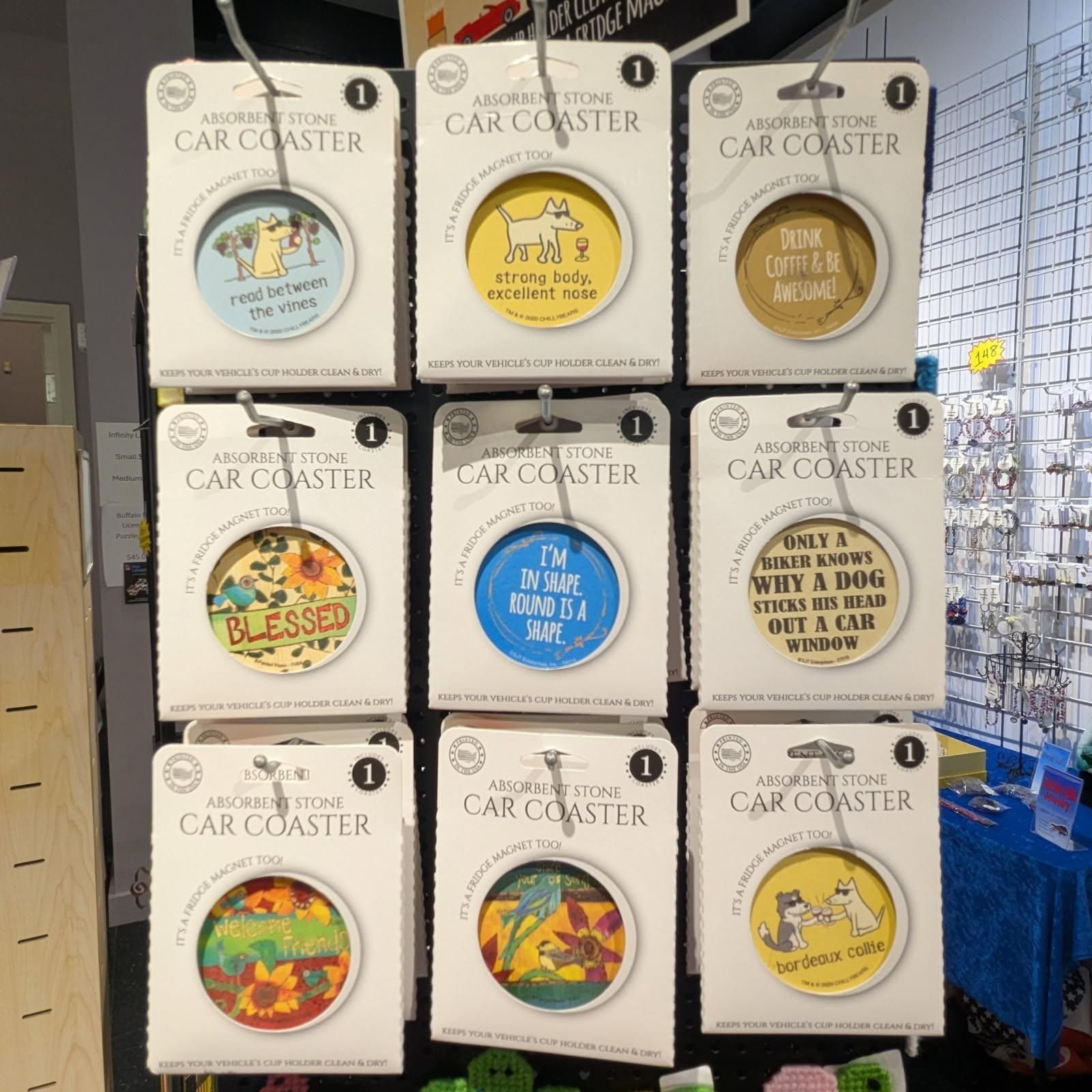 Nine car coasters displayed, each with a different design and humorous text.