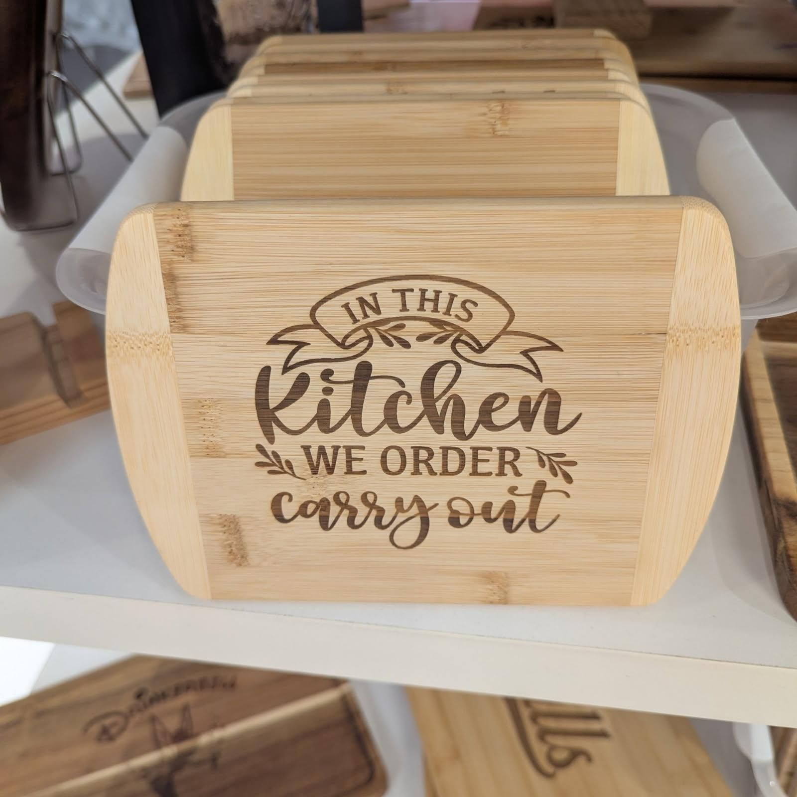 Wooden cutting board with etched text: 