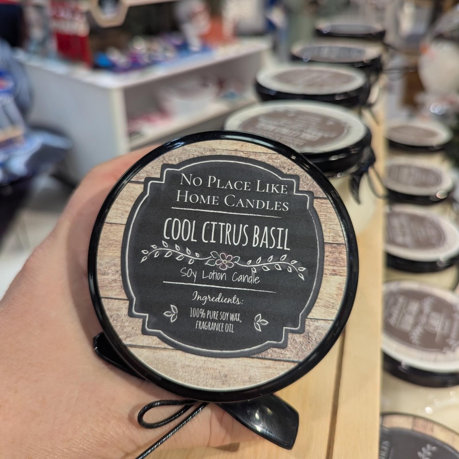 Person holding a candle labeled 