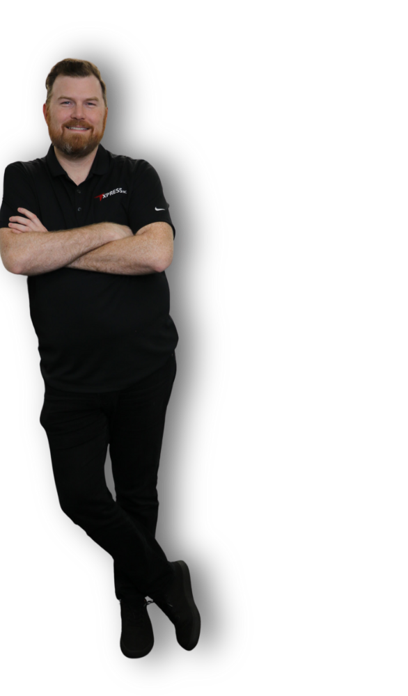 Man in black shirt and pants leaning against a white surface, arms crossed.