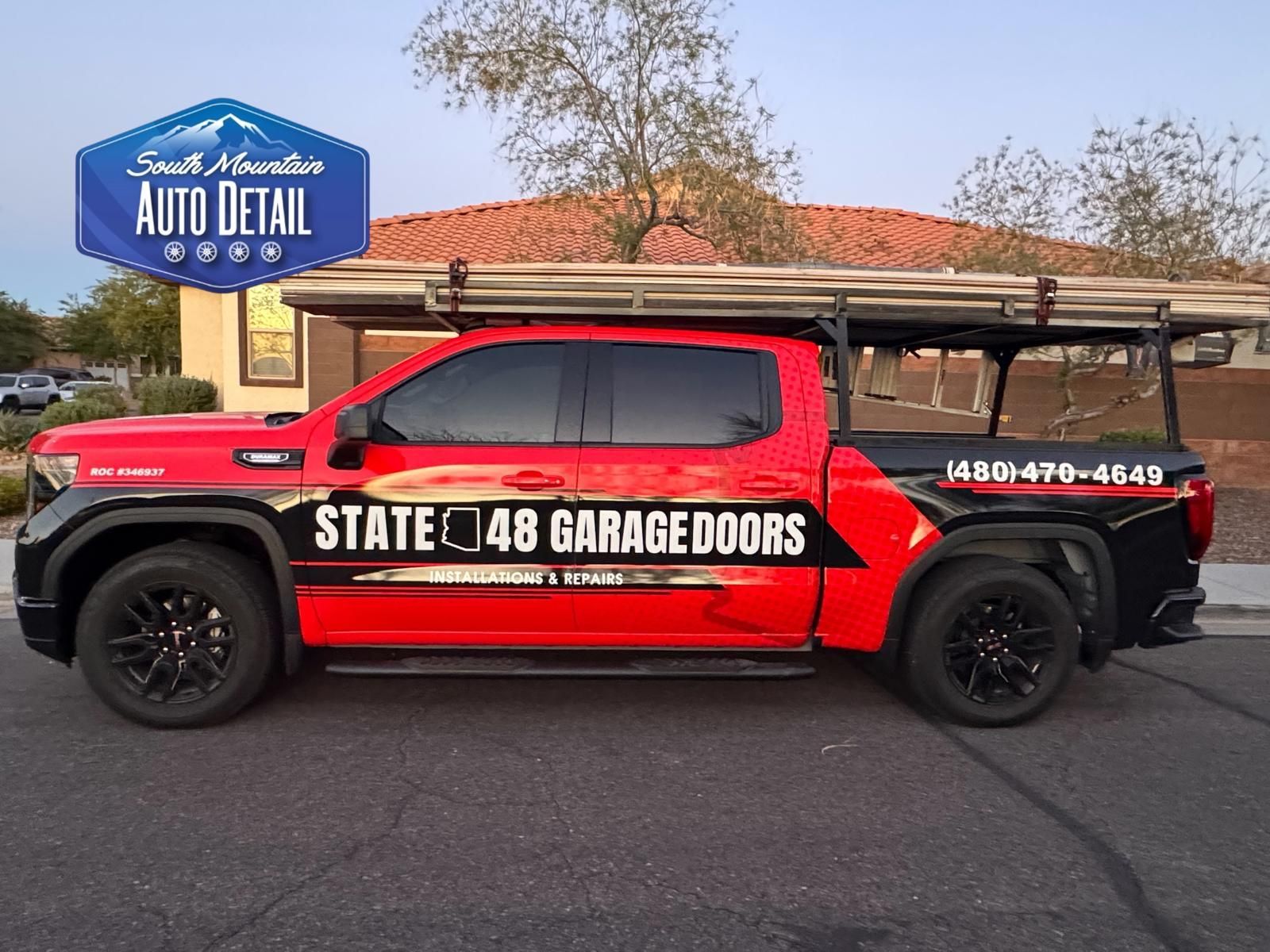 A red and black truck branded with