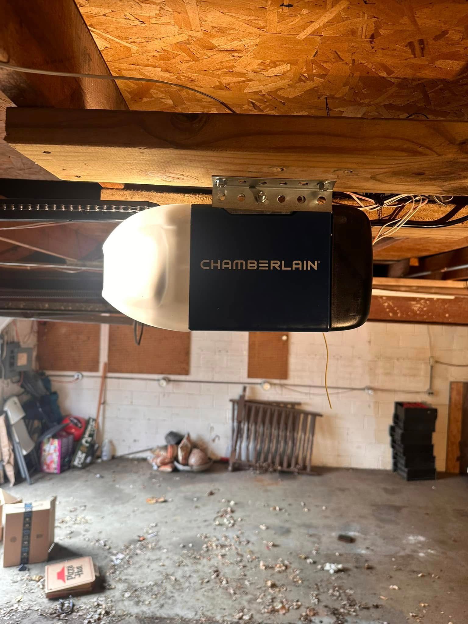Garage interior with a Chamberlain garage door opener.