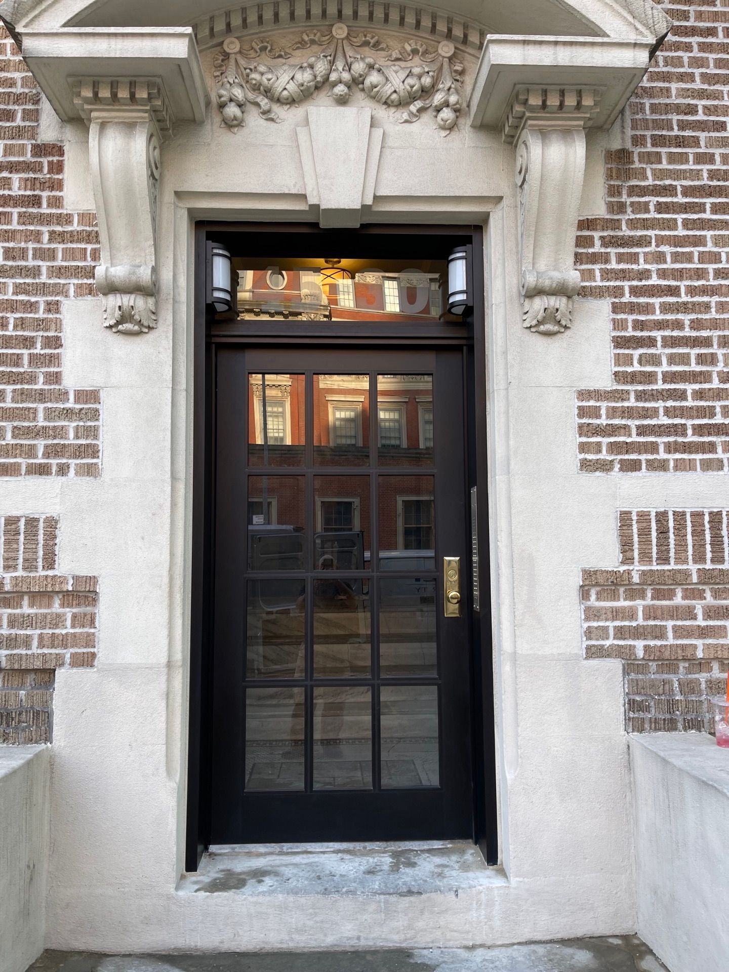 Newly installed front door at an apartment building in Long Island City, Queens 
