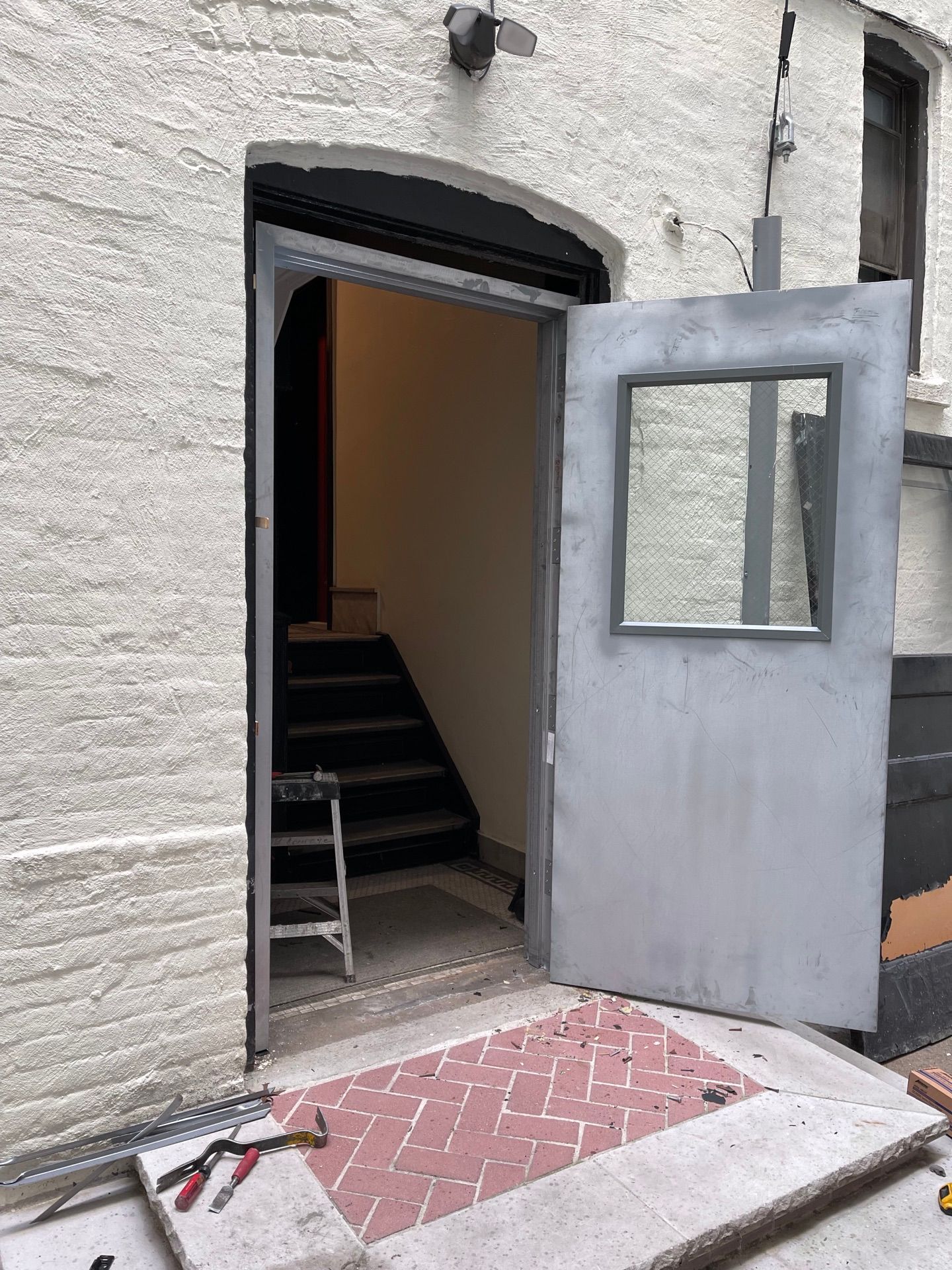 New metal door install at an apartment building in Long Island City, Queens 