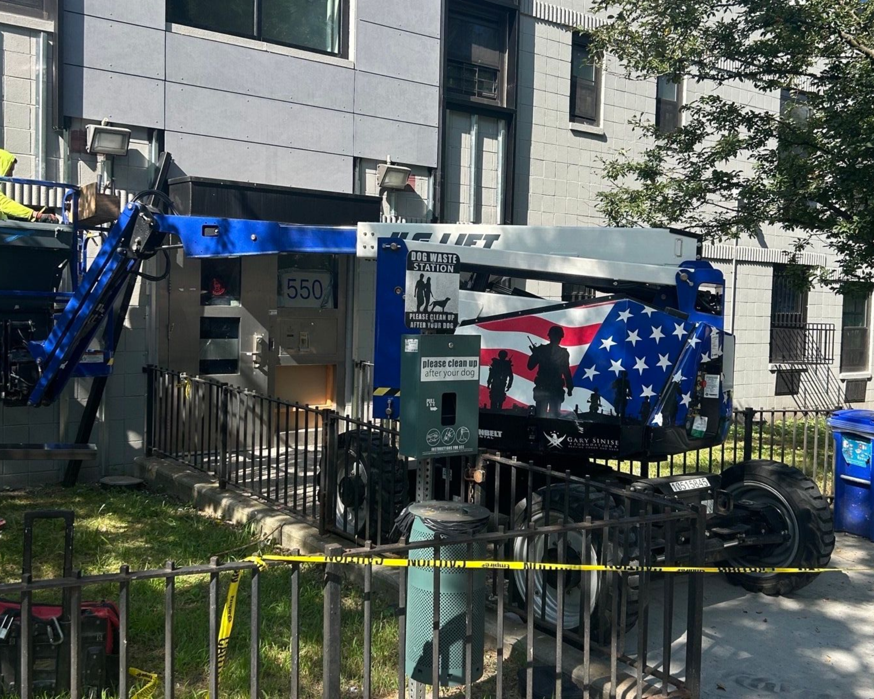 Boom lift positioned for energy-efficient window installation at a Bronx apartment building managed by a multifamily property group — Parker Custom Security