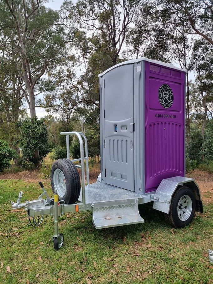 Purple portaloo single trailer— Toilet Hire in Sunshine Coast, QLD