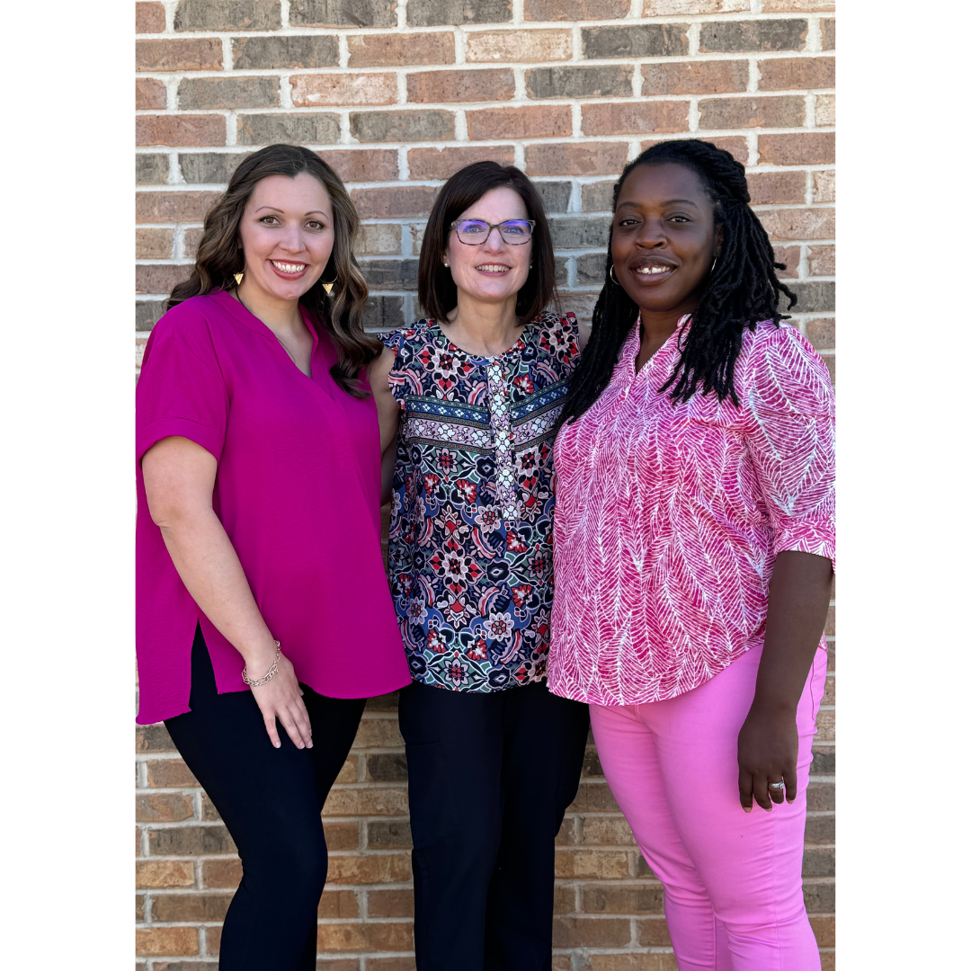 Dr. Lauri Bullen OB/GYN ,Makayla Hardeman, NP and Juaquasha Hackley, WHNP-BC posing together outdoors