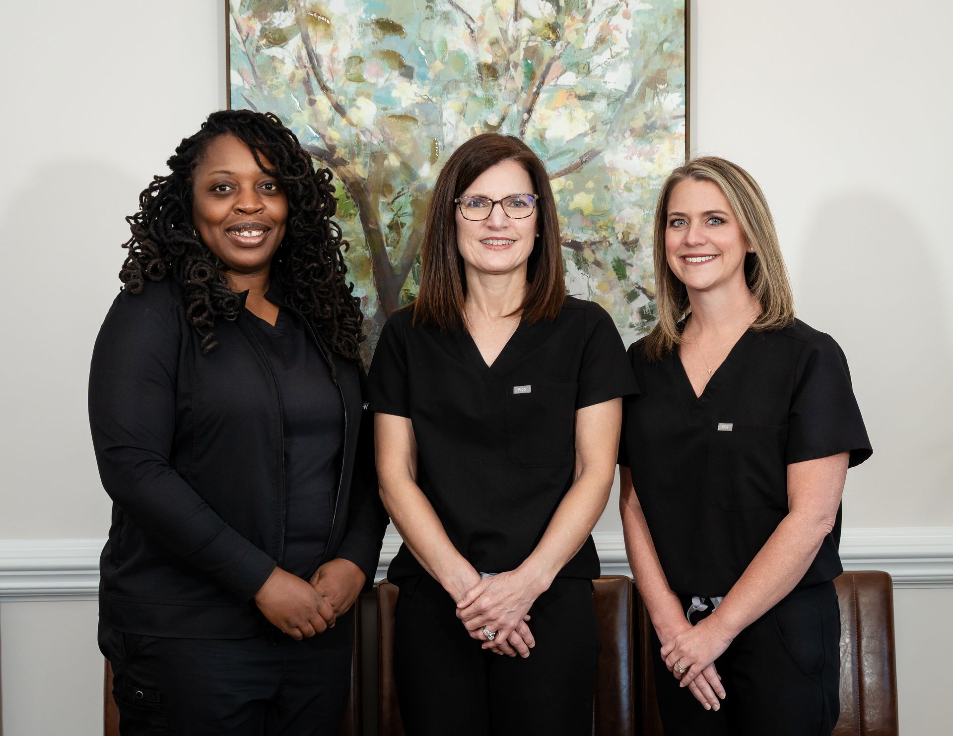 Dr. Lauri Bullen OB/GYN ,Makayla Hardeman, NP and Juaquasha Hackley, WHNP-BC posing together outdoors