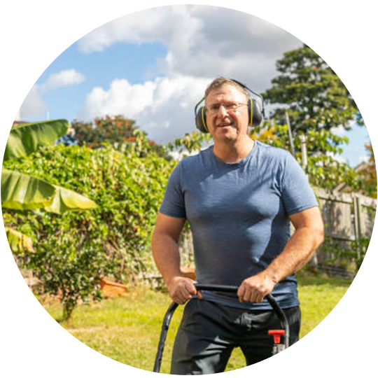 Man Mowing The Lawn — Brisbane, QLD — Black & White Home Services