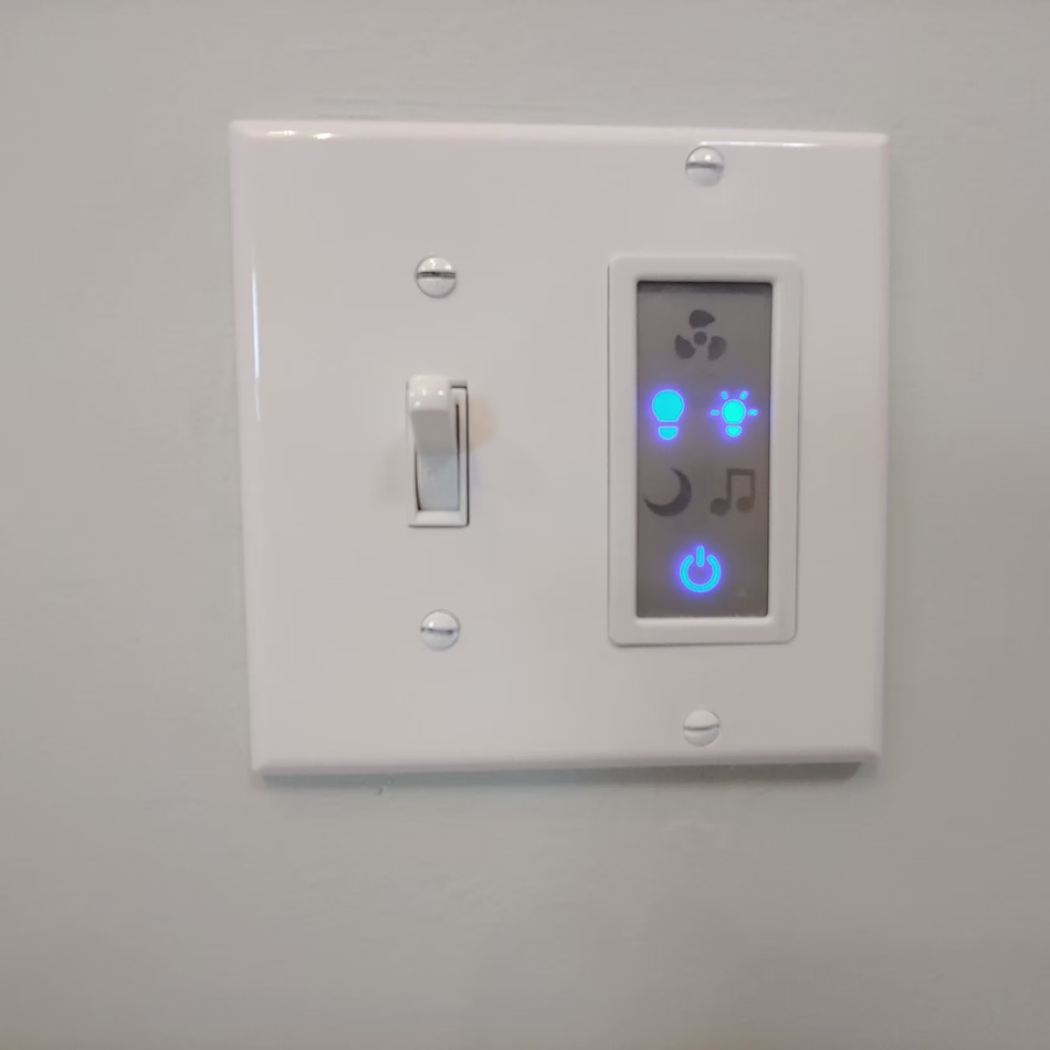 Wall thermostat with blue-lit display and a nearby light switch on a white wall