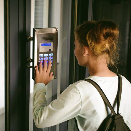 woman adjusting security system