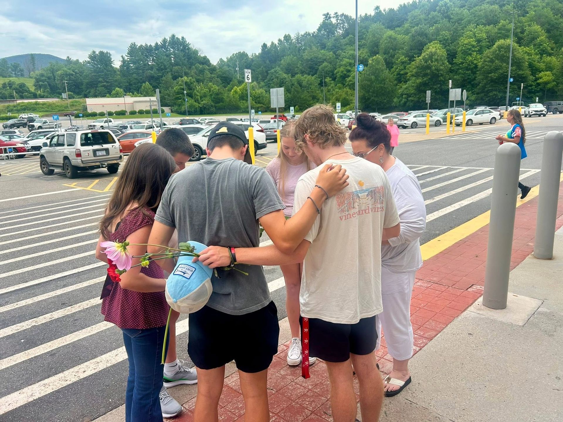 Teens praying together in Stuart