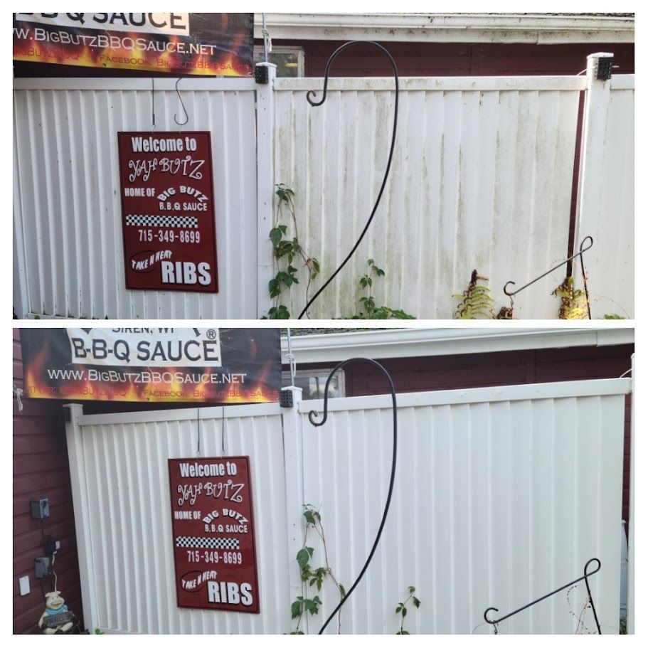 A white fence with a sign that says bbq sauce ribs