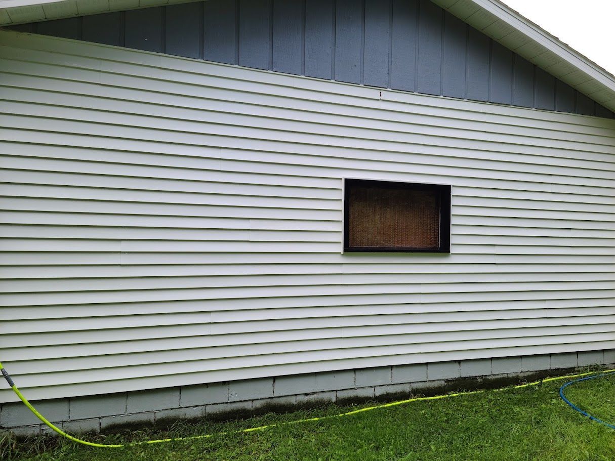 A house with a window on the side of it.