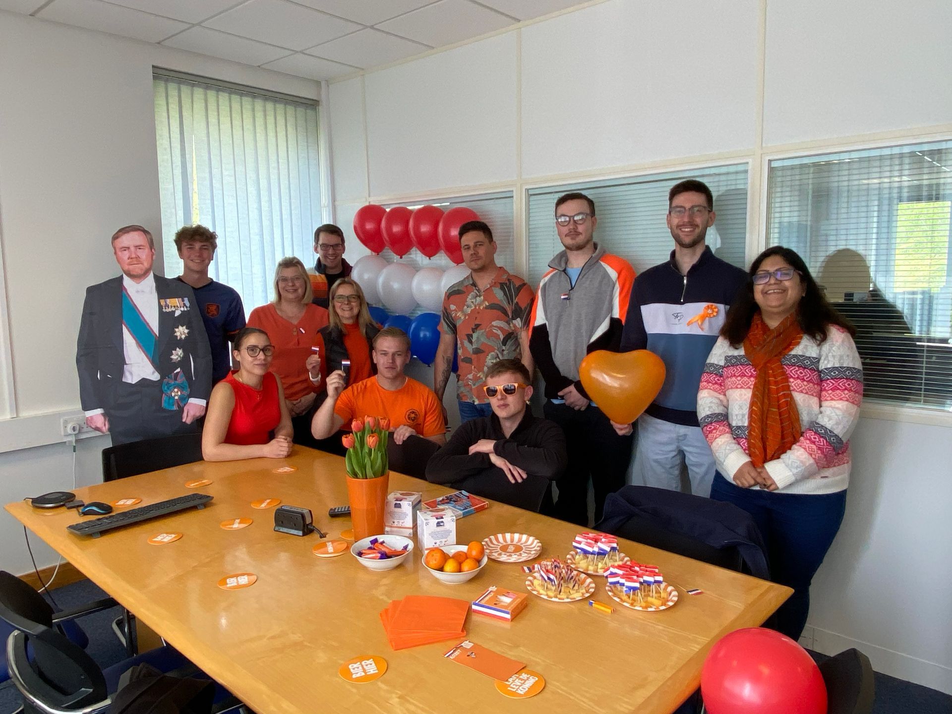 Group of MCFT Office Staff Wearing Orange For King's Day
