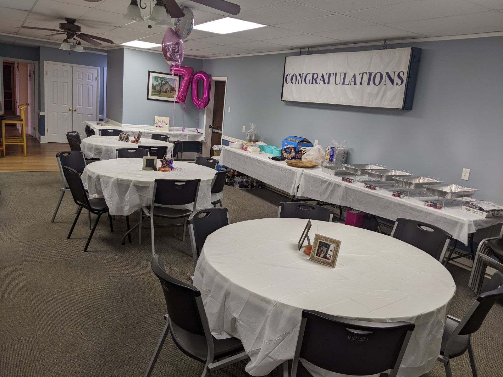 Event Hall with Tables and Banner