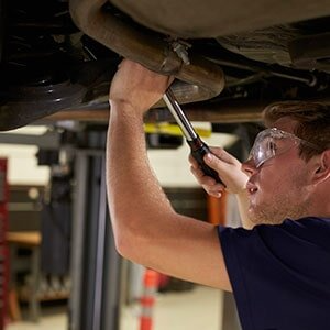 Custom Exhaust — Screwing The Exhaust Pipe in West Swanzey, NH