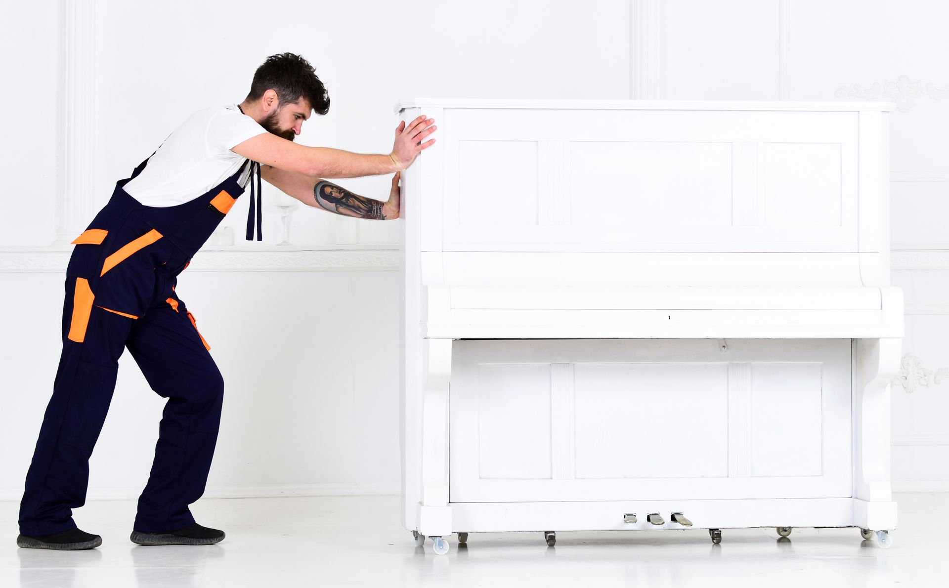 A man is moving a piano.