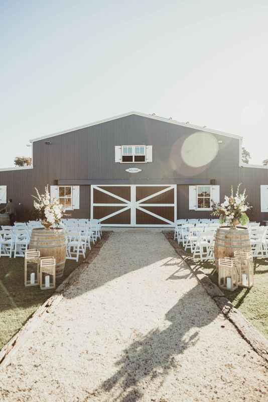 A wedding ceremony is taking place in front of Aberfeldy Barn.