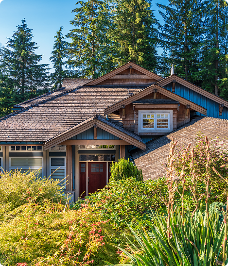 A house with a brown roof and white trim