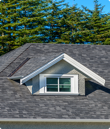 A close up of a gutter on the roof of a house.