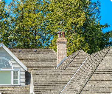 An aerial view of a house with a slate roof.