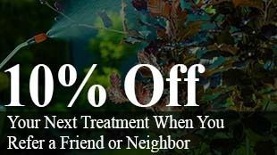 A sign that says `` 10 % off your next treatment when you refer a friend or neighbor ''