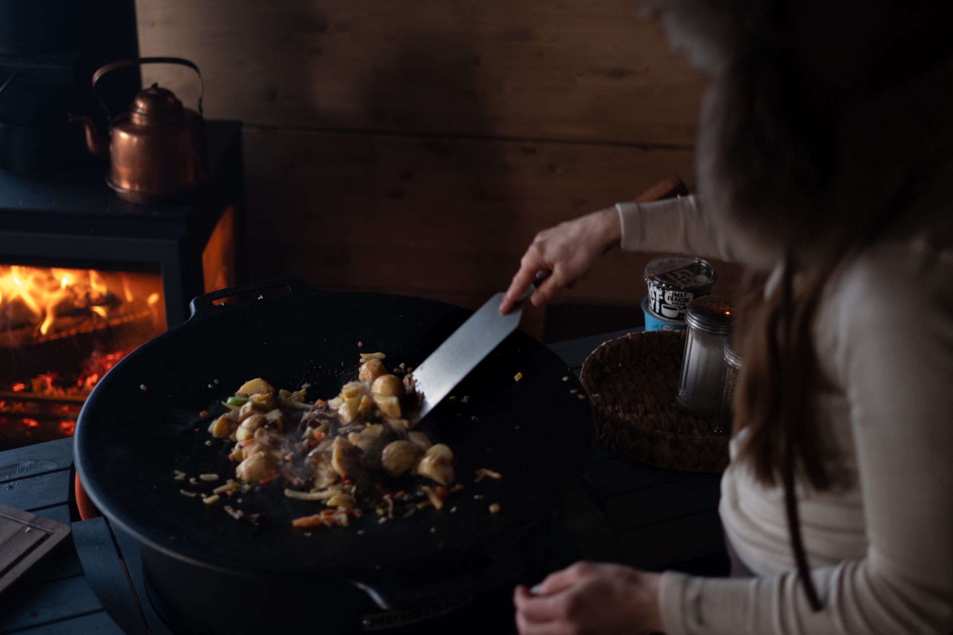 Cooking in front of fire place.