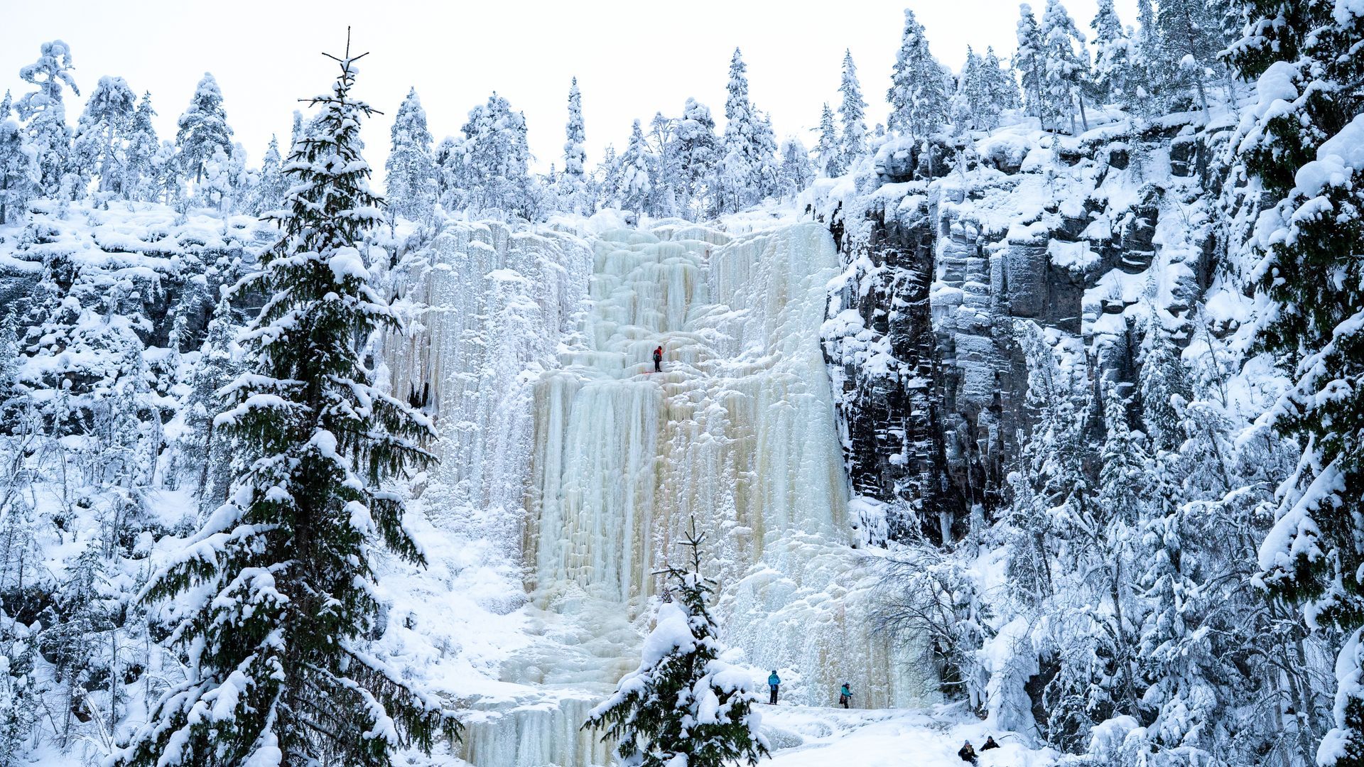 Korouoma canyon ice falls with people climbing on the ice.