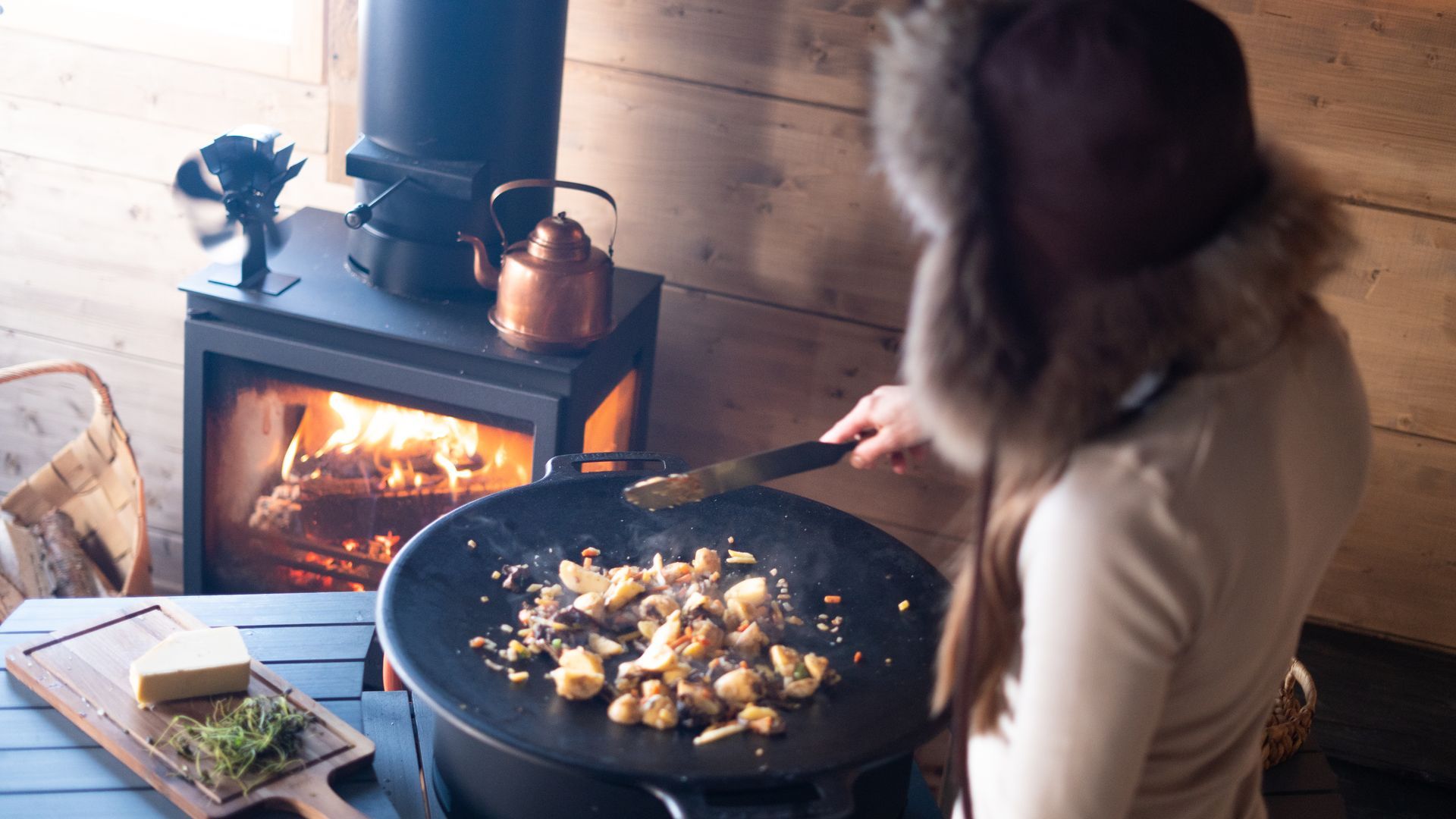 Cooking in front of fire place.