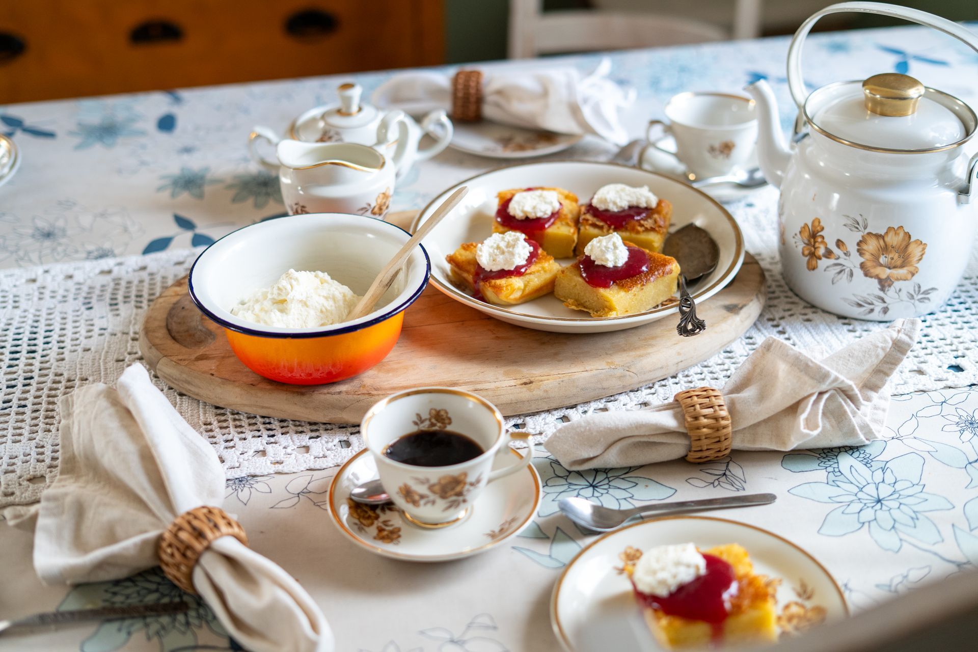 Table set beautifully in a vintage style with dessert tart and coffee from vintage coffee set