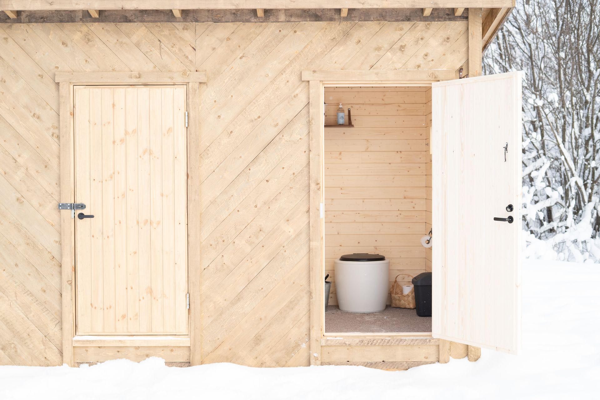 Outhouse door open.