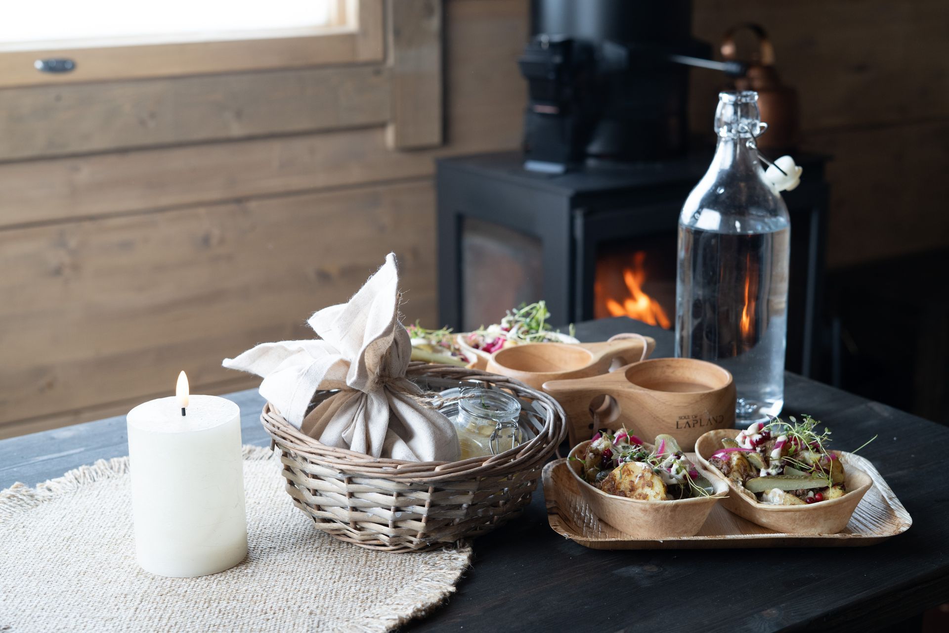 Lapland styled food set in front of fireplace.
