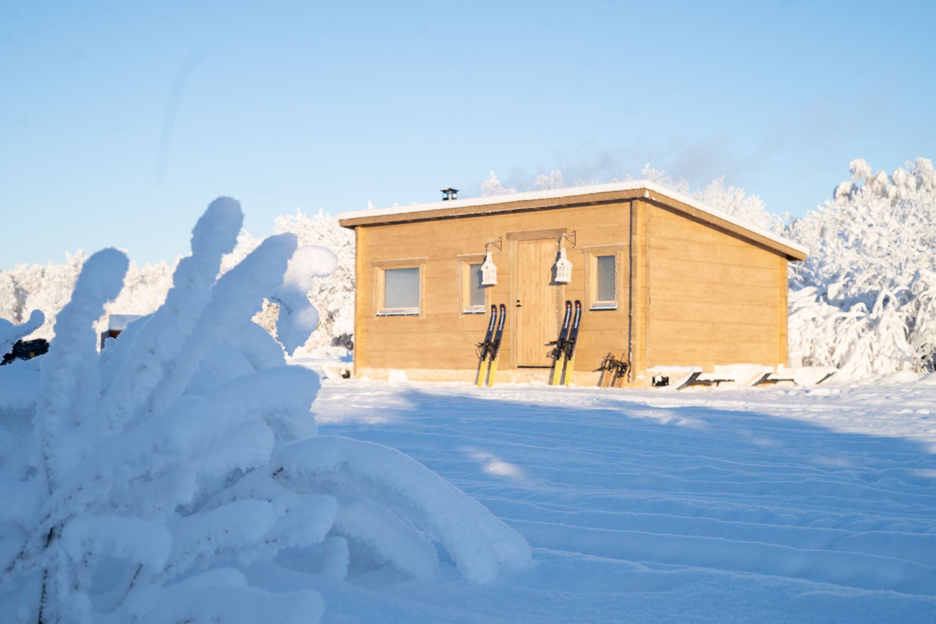 Log cabin in snowy landscape.